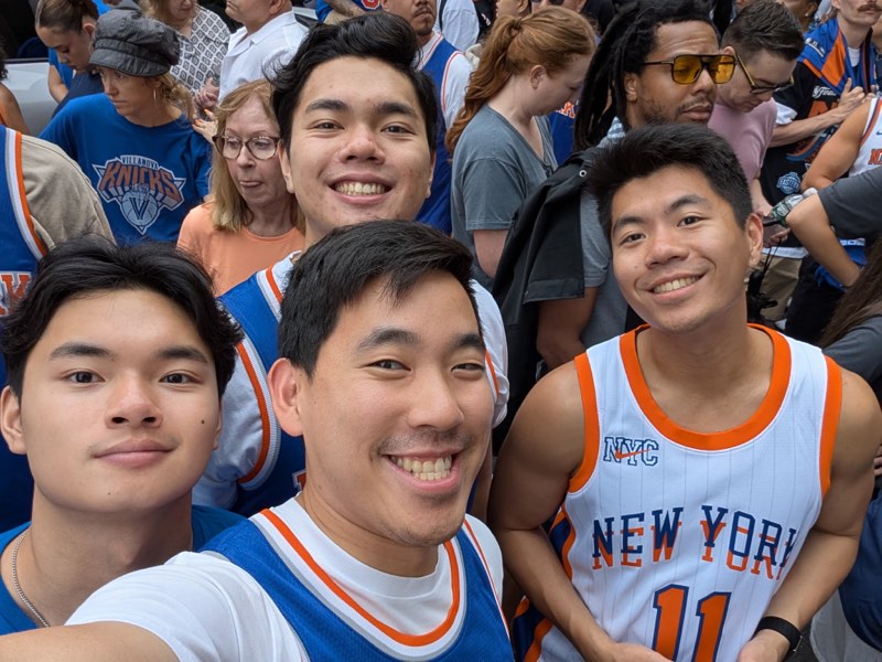 Jonathan and three friends in Knicks jerseys in a crowd outside the arena